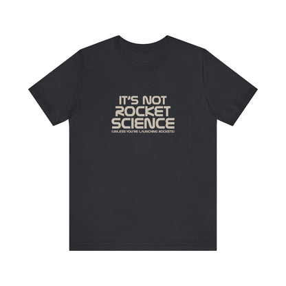 It’s Not Rocket Science (Unless You’re Launching Rockets) – Retro Tee (Dark)